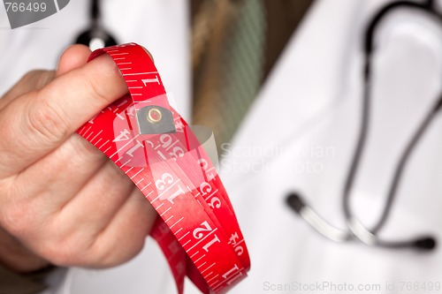 Image of Doctor with Stethoscope Holding Measuring Tape