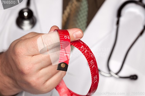 Image of Doctor with Stethoscope Holding Measuring Tape