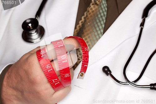 Image of Doctor with Stethoscope Holding Measuring Tape