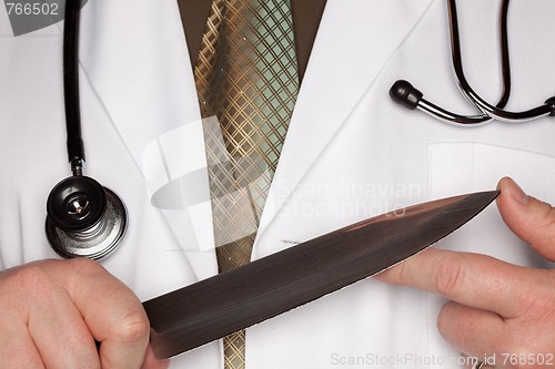 Image of Doctor with Stethoscope Holding A Large Knife