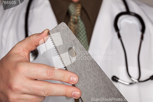 Image of Doctor with Stethoscope Holding A Sharp Saw