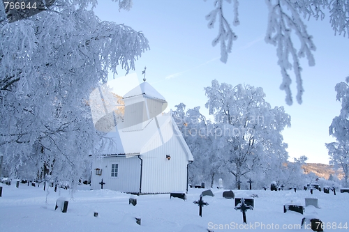 Image of White chapel and cemetery