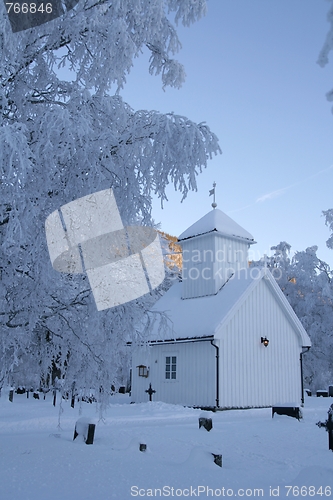 Image of White chapel with cemetery