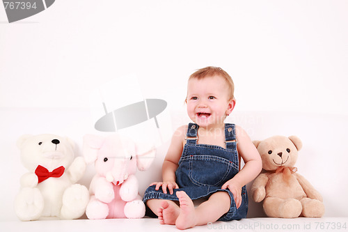 Image of Lovely baby girl with toys