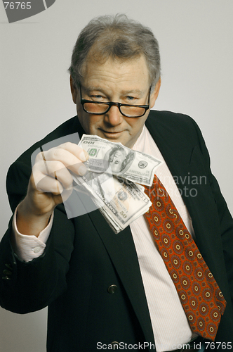 Image of executive with cash