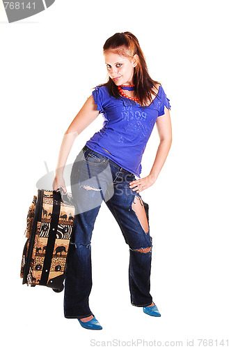 Image of Girl on a trip with suitcase.