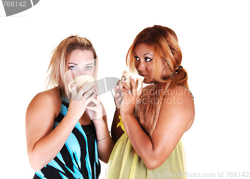 Image of Two girls drinking coffee.