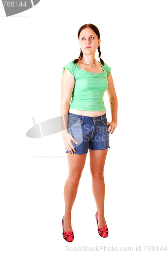 Image of Pretty girl in jeans shorts.