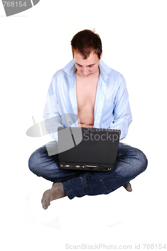 Image of Teen with laptop and open shirt.