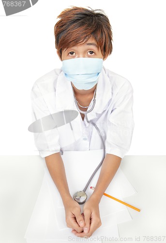 Image of Worried doctor w surgical mask