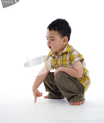 Image of small boy pointing at something