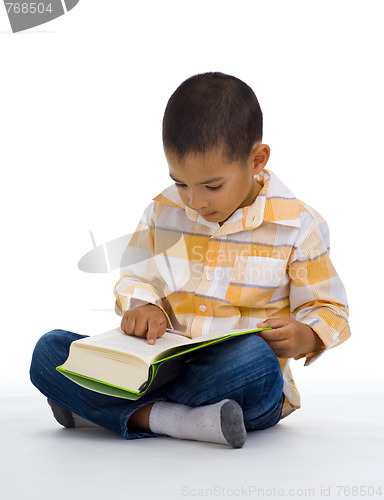 Image of cute boy reading a book