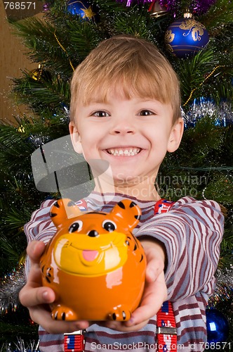 Image of Boy with piggy bank