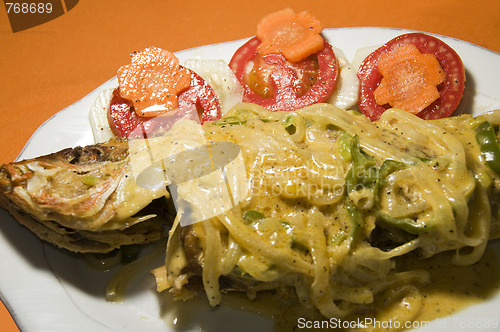 Image of caribbean style whole fish with salad