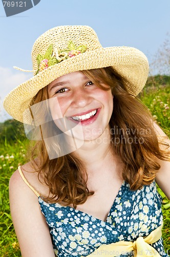 Image of Portrait of young girl smiling in meadow