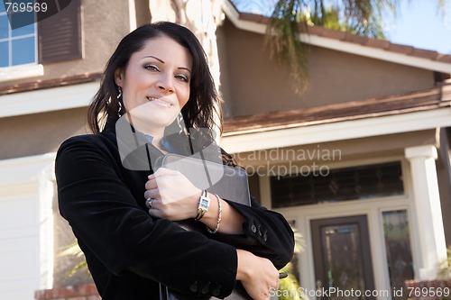 Image of Attractive Hispanic Female Business Woman in Front of New Home