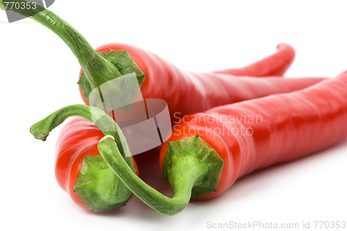 Image of three red chilly peppers