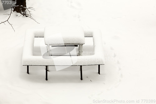 Image of Little table covered with powder snow