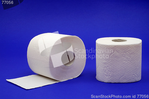 Image of Two rolls of toilet paper on a blue background