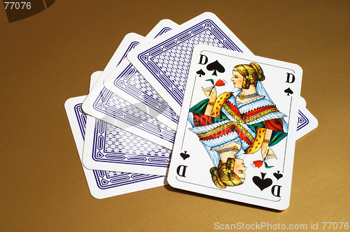 Image of Playing cards with a queen of spades