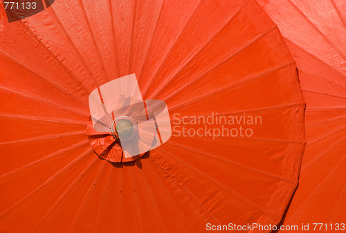 Image of Orange cotton umbrellas in Thailand