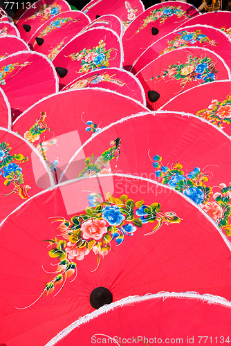 Image of Hand painted pink umbrellas in Thailand