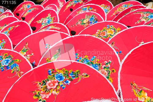 Image of Hand painted pink umbrellas in Thailand