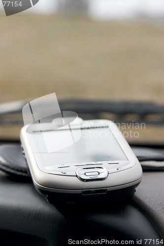 Image of PDA - Palm on the deck of the car