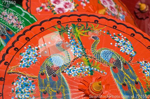 Image of Hand painted orange umbrellas in Thailand