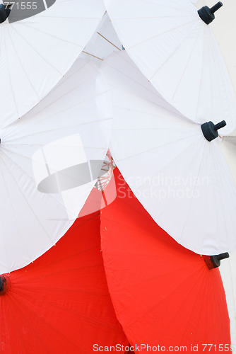 Image of Red and white traditional umbrellas in Thailand