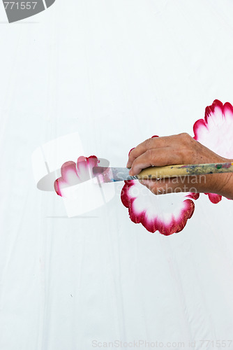 Image of Hand painting flowers on white fabric