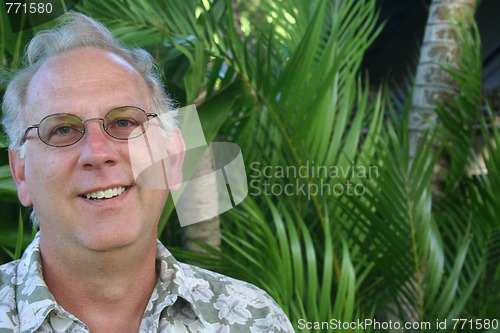 Image of Smiling Man in Tropical Location