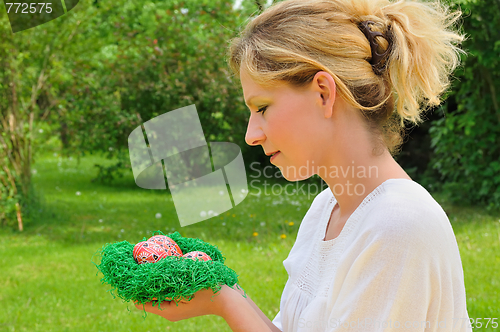 Image of Young woman and easter eggs