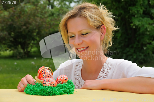 Image of Young woman and easter eggs