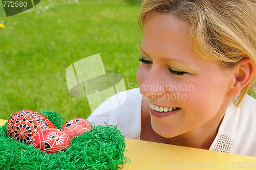 Image of Young woman and easter eggs