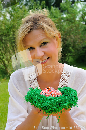 Image of Young woman and easter eggs