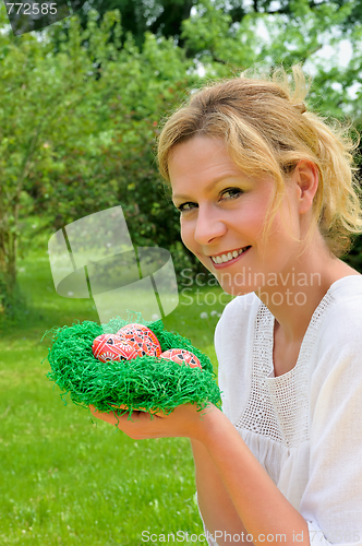 Image of Young woman and easter eggs