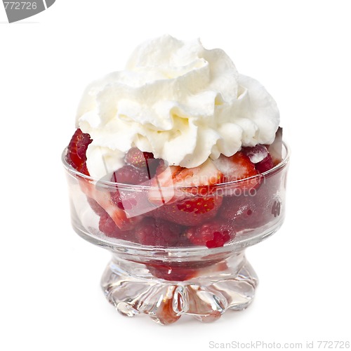 Image of Fresh raspberries and strawberries with whipped cream