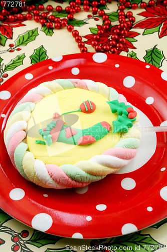 Image of Christmas sucker on red plate