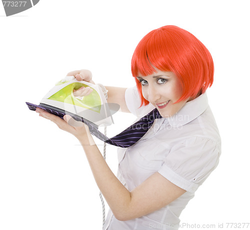 Image of happy woman ironing tie 