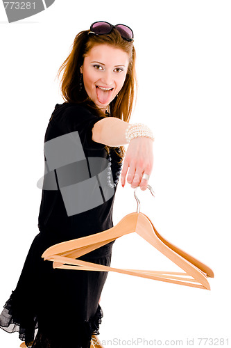 Image of Woman holding hanger with tongue hang on