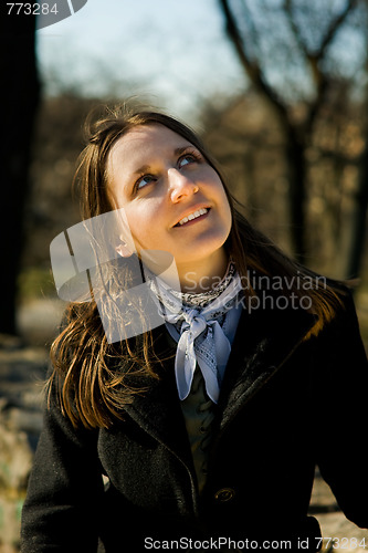 Image of young woman looking up
