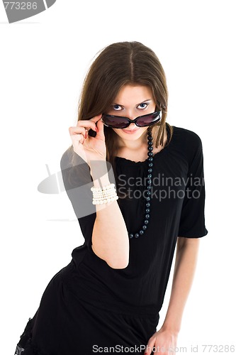 Image of Woman looking out from sunglasses