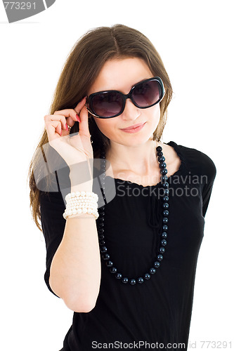 Image of Woman in black dress and sunglasses