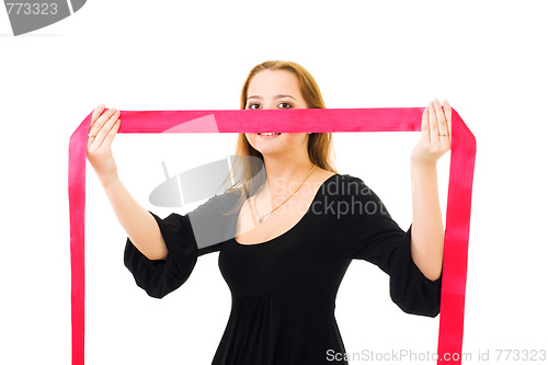 Image of romantic woman hiding behind red ribbon
