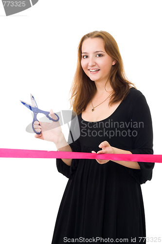 Image of Woman cutting a red ribbon 