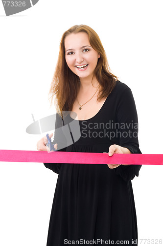 Image of Woman cutting a red ribbon