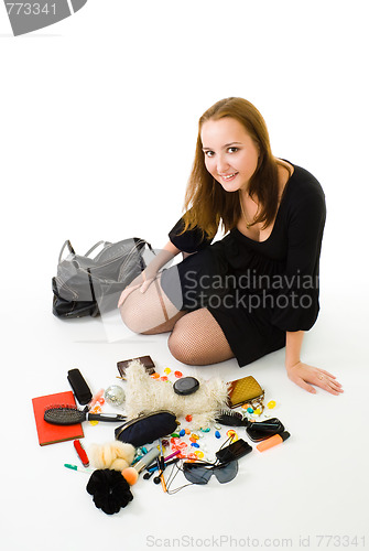 Image of Woman with accessories from woman handbag