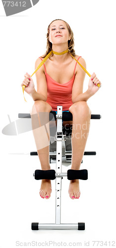 Image of  woman sitting on bench for fitness