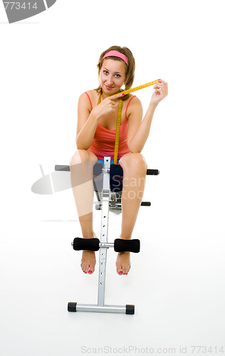 Image of Woman with centimetre after fitness